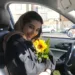 HANDOUT PHOTO: Parnia Abbasi holds a sunflower, her favorite flower, in Tehran, Iran. Abbasi, 23, was killed by an Israeli airstrike at her apartment building in the Sattarkhan neighborhood of Tehran on Friday morning.

(Photo by Arvin Abedi)